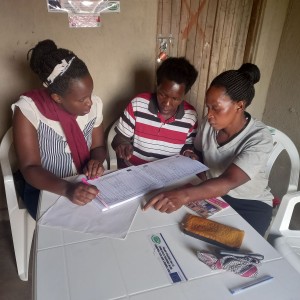 Peruth of NAPE during progress monitoring visit at a safe space in Kyakatemba,Kikuube district.